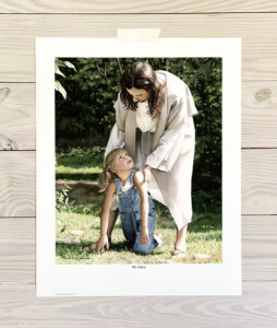 Jesus helping a little girl who's fallen down