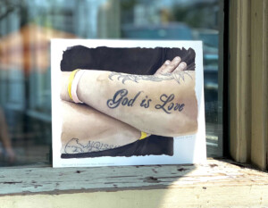 Watercolor print of a man's arms folded, revealing a tattoo that says, "God is Love"